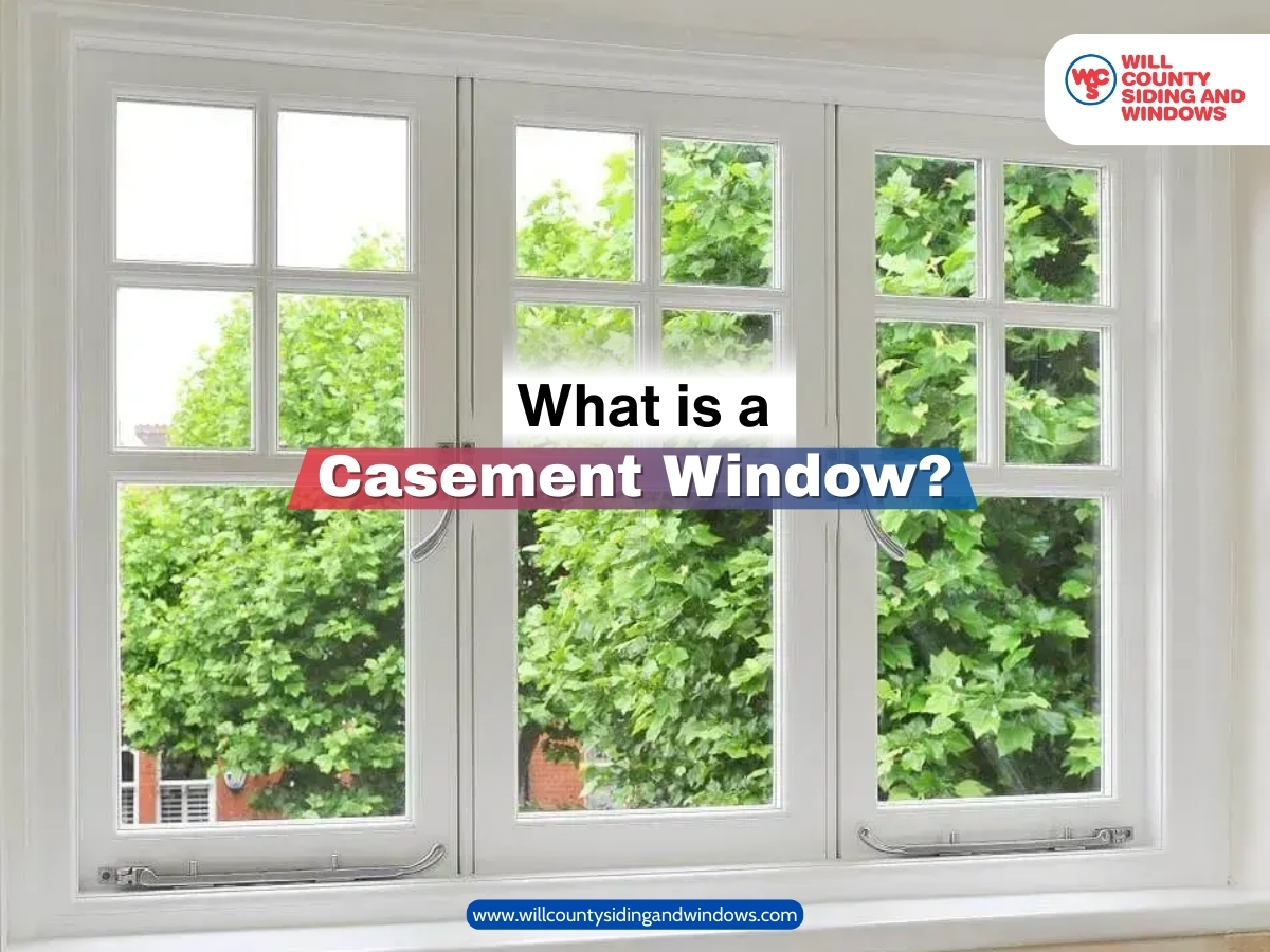 A bright white casement window with clear glass panels opening outward, showing a lush green view outside.