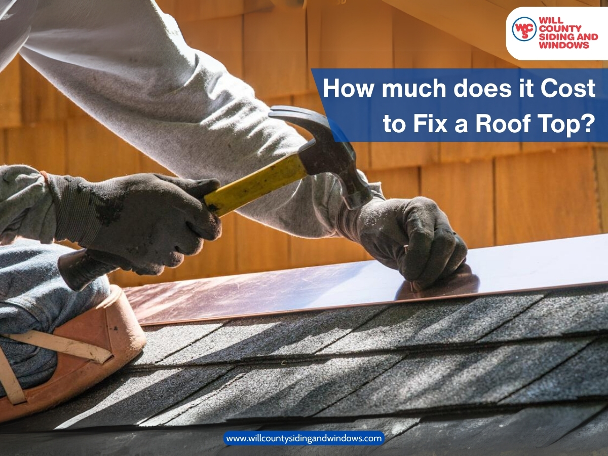 Roofer using a hammer to fix asphalt shingles on a rooftop, with text asking, "How much does it cost to fix a roof top?" and the Will County Siding and Windows logo.